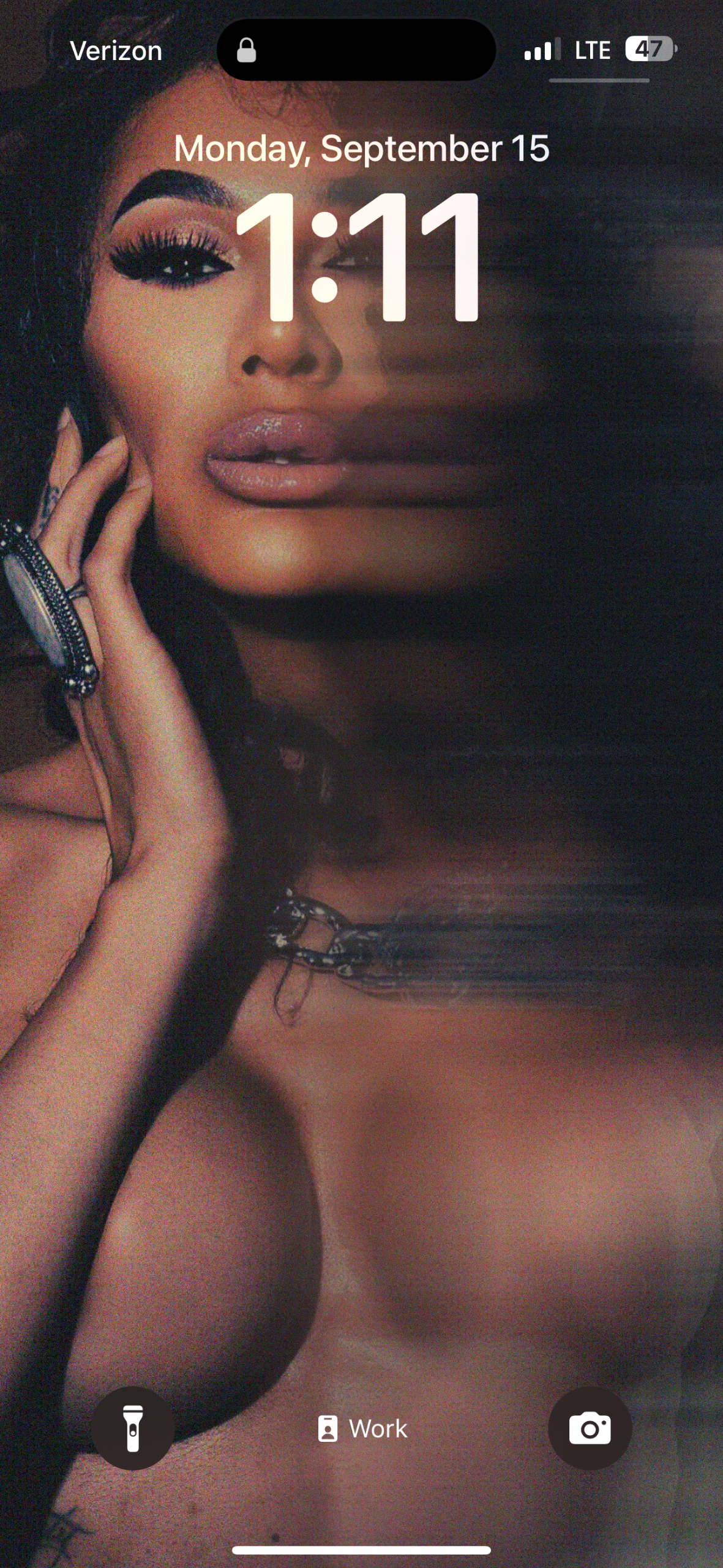 A moody close portrait of Gia styled like a phone lock screen